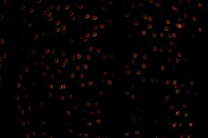 abstract bokeh background of golden light burst made from bokeh motion. photo