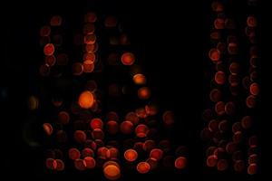 abstract bokeh background of golden light burst made from bokeh motion. photo