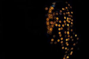 abstract bokeh background of golden light burst made from bokeh motion. photo