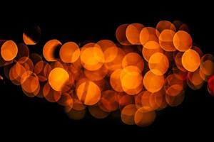 abstract bokeh background of golden light burst made from bokeh motion. photo