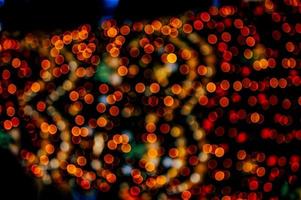 abstract bokeh background of golden light burst made from bokeh motion. photo