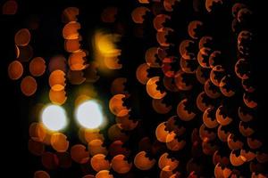 abstract bokeh background of golden light burst made from bokeh motion. photo