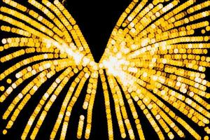 abstract bokeh background of golden light burst made from bokeh motion. photo