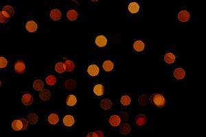 abstract bokeh background of golden light burst made from bokeh motion. photo