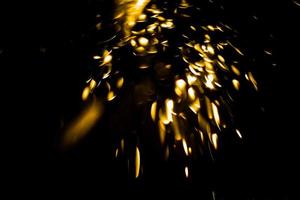 background of abstract glitter lights. gold and black. de focused photo