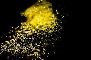 background of abstract glitter lights. gold and black. de focused photo