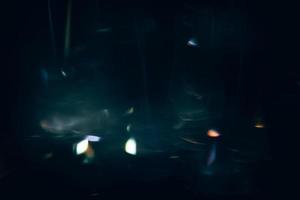 Scratched background. Lens flare effect. Blue distressed aged faded grunge surface with smeared stains dust noise colorful light design. photo