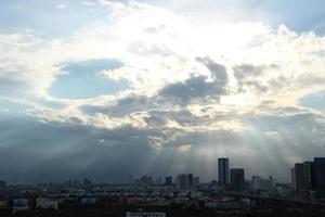 bright golden cloudy sky in sunset background in city building town photo