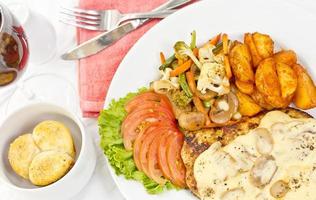 Peri peri Chicken with Button mushroom gravy, Saute Vegetables, Spicy fried Potatoes with Tomato Lettuce Salad. photo