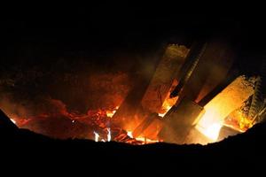 Heated metal pig gets squeezed and drilled at special metal forging unit at Brueck metal forging factory in Demra, Dhaka, Bangladesh. photo