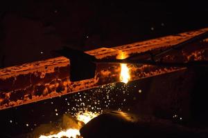 Gas cutting of the hot metal in steel plant at Demra, Dhaka, Bangladesh photo