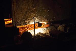 Gas cutting of the hot metal in steel plant at Demra, Dhaka, Bangladesh photo