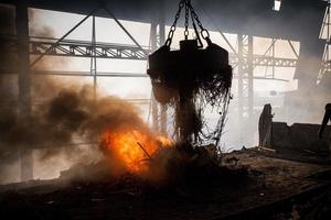 Scrap steel melts down in an induction furnace at Demra, Dhaka, Bangladesh. photo