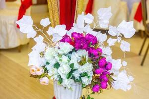 Pink and white Hand made paper flower at wedding Table decoration in Bangladesh. photo