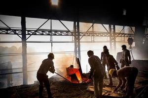 Bangladesh May 19, 2015 Blast furnace in the melt steel works, risky workers in steel fa photo