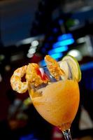 A glass of mouthful tasty Shrimp Cocktail Appetizer. photo