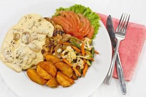 Peri peri Chicken with Button mushroom gravy, Saute Vegetables, Spicy fried Potatoes with Tomato Lettuce Salad. photo