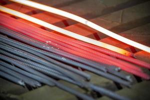 Heated metal pig gets squeezed and drilled at special metal forging unit at Brueck metal forging factory in Demra, Dhaka, Bangladesh. photo