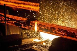 Gas cutting of the hot metal in steel plant at Demra, Dhaka, Bangladesh photo