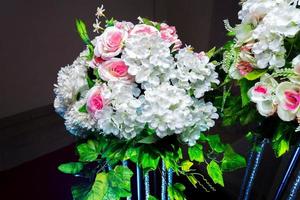 White and green color based artificial plastic flowers a bouquet. wedding decoration. photo