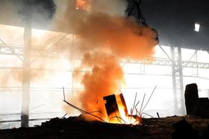 Scrap steel melts down in an induction furnace at Demra, Dhaka, Bangladesh. photo