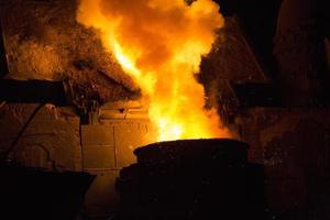 Heated metal pig gets squeezed and drilled at special metal forging unit at Brueck metal forging factory in Demra, Dhaka, Bangladesh. photo