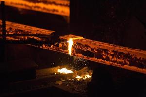 Gas cutting of the hot metal in steel plant at Demra, Dhaka, Bangladesh photo