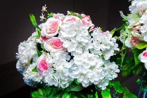 White and green color based artificial plastic flowers a bouquet. wedding decoration. photo