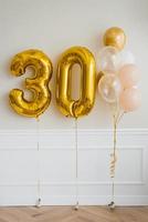 Festive helium balloons in gold and white, number 30 photo