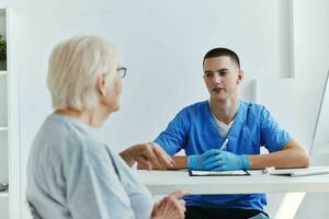 old woman at the doctor health and medicine photo