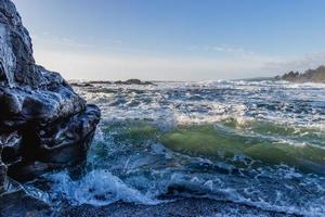 Close up of wave crashing on a rock at Botanical Beach at Juan De Fuca Provincial Park on Vancouver Island, Canada photo