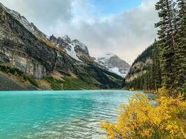 Snow capped moutains and glacier at Lake Louise in Banff National Park, Alberta photo