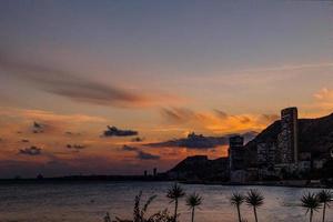 picturesque sunset on the beach in the Spanish city of Alicante photo