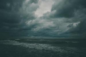 wide beach on the Baltic Sea in Poland on a summer cloudy gray cold day photo