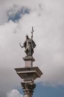 old historic zygmunt column in warsaw, poland against the blue sky photo