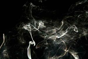 Smoke effect texture. Isolated background. Black and dark backdrop. Smokey fire and mistic effect. photo