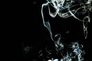 Smoke effect texture. Isolated background. Black and dark backdrop. Smokey fire and mistic effect. photo