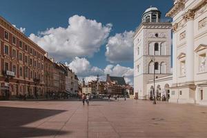 landscape from the square of the old town of Warsaw in Poland with the royal castle and tenement houses photo