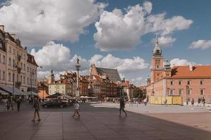 landscape from the square of the old town of Warsaw in Poland with the royal castle and tenement houses photo