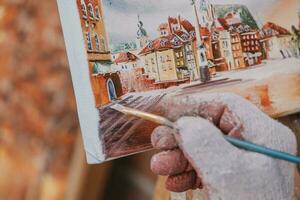 painting from old town of warsaw in poland during painting in close-up photo