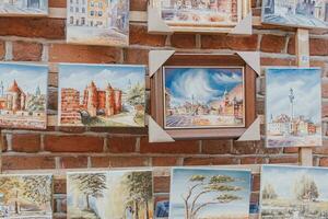 paintings on canvas showing the old town of warsaw in poland souvenirs from holidays photo