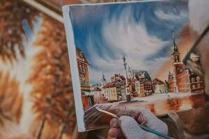 painting from old town of warsaw in poland during painting in close-up photo