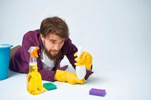 man with a bucket on the floor detergent service lifestyle photo