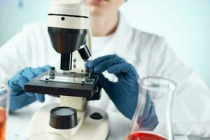 woman laboratory assistant microscope diagnostics research microbiology photo