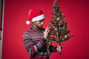 cute man in christmas clothes christmas tree toys lifestyle photo