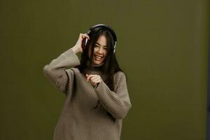 woman wireless headphones music fun technology isolated background photo