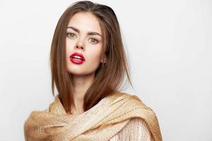 A lady with a shawl model is looking forward on the shoulders red lips photo