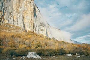 landscape autumn high mountains on blue sky dry grass fresh air photo