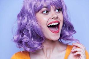 Attractive and smiling model purple hair disco photo