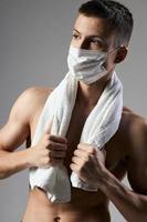 cute man pumped up body medical mask safety gym photo